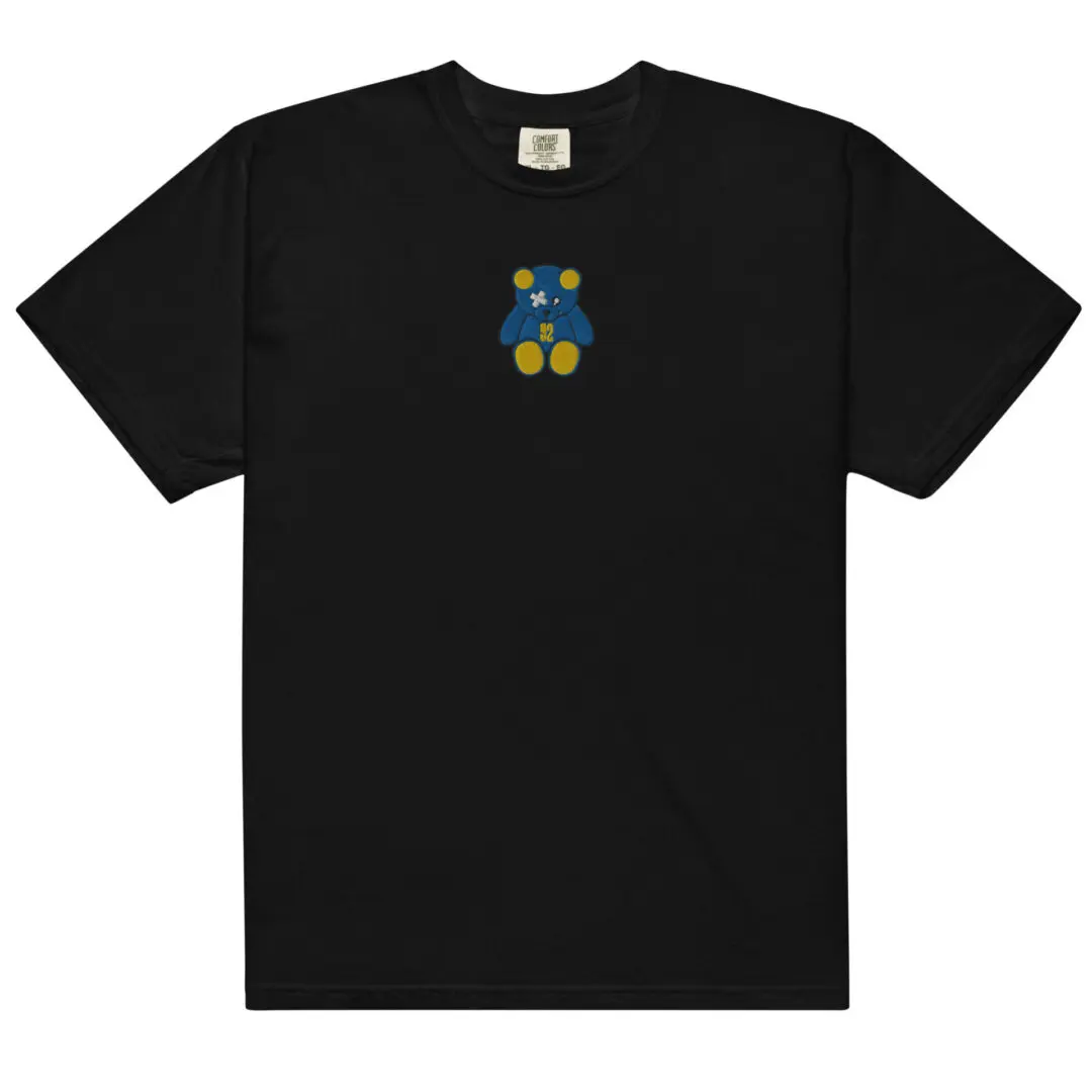 A black t-shirt with a blue and yellow teddy bear on it.