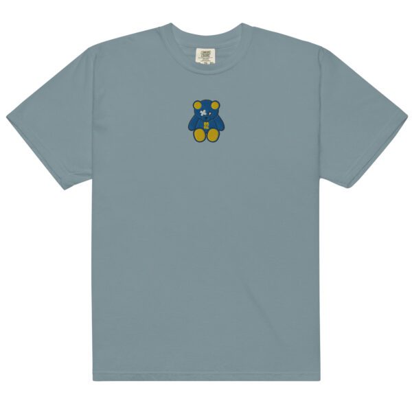 A light blue t-shirt with an embroidered bear on the front.