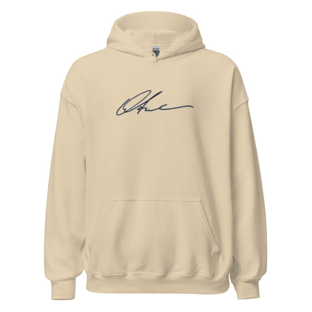A beige hoodie with the word " charlie " written on it.