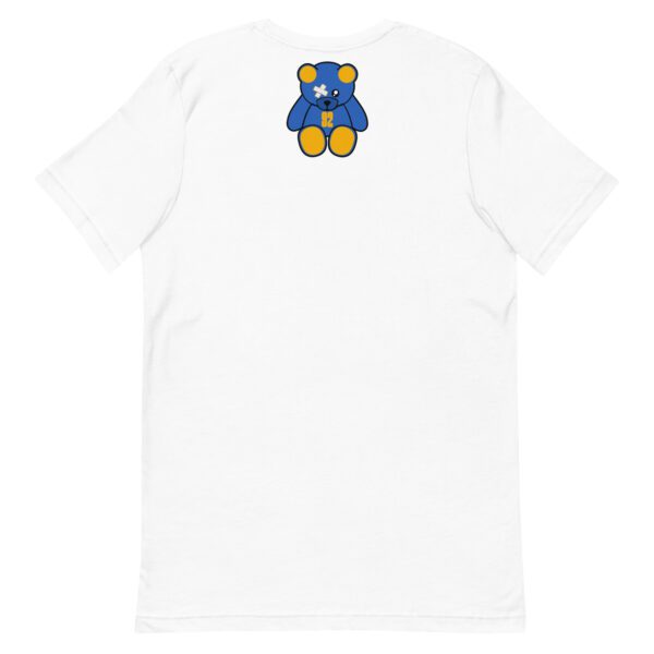 A white t-shirt with a blue and yellow bear on the back.